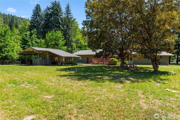 a balcony with wooden floor and fence