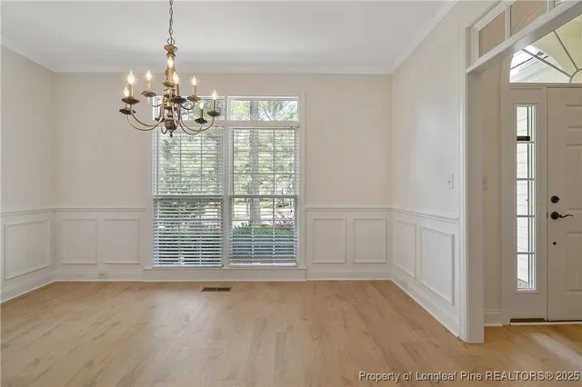 a kitchen with stainless steel appliances granite countertop wooden cabinets a stove top oven a sink and dishwasher