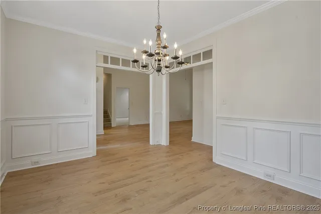 a view of a room with windows and chandelier