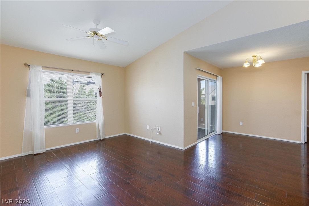 6650 West Warm Springs Road, Unit 2027 Las Vegas, NV 89118 - Photo 6 of 29 This airy room features rich hardwood flooring and a ceiling fan, perfect for comfortable living.