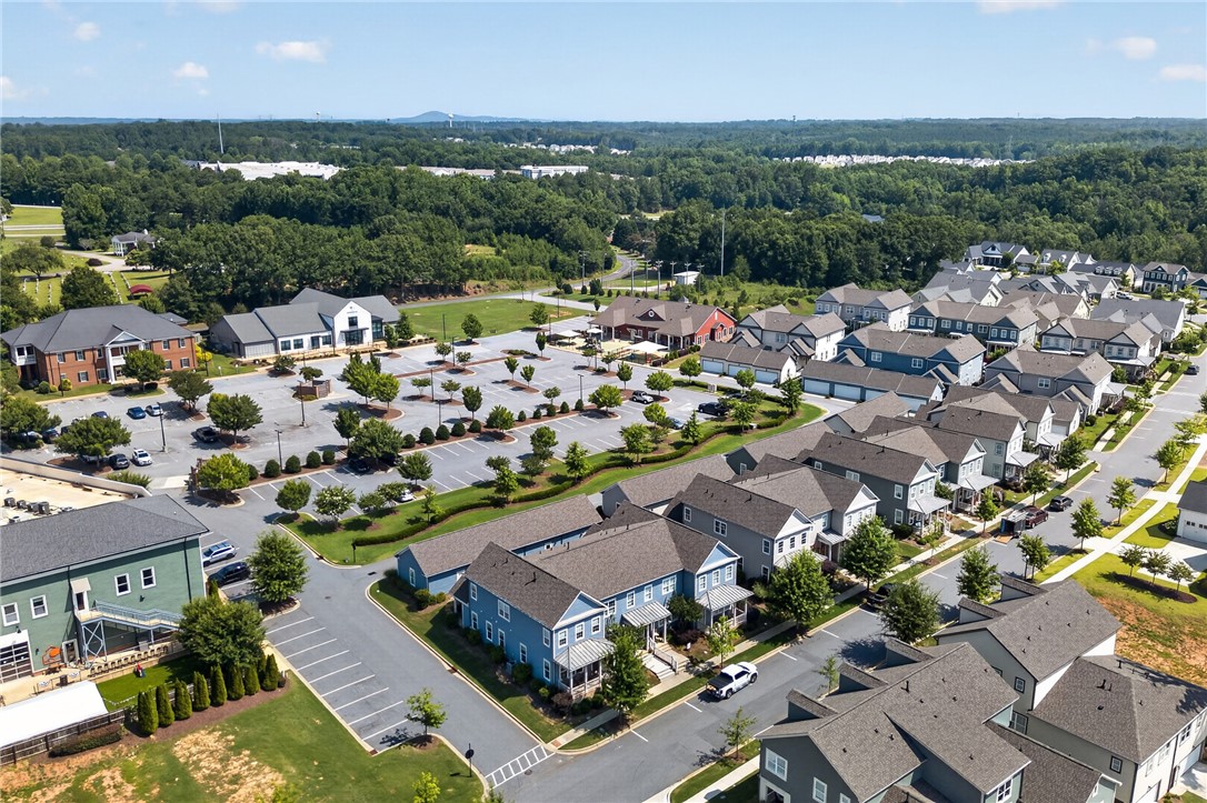 112 Tuttle Street Clemson, SC 29631 - Photo 35 of 46 An aerial perspective reveals a vibrant community with an array of modern residences and convenient parking amidst verdant landscapes.