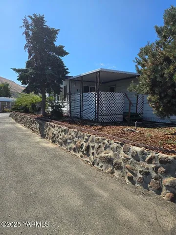 a view of a house with a snow in the yard