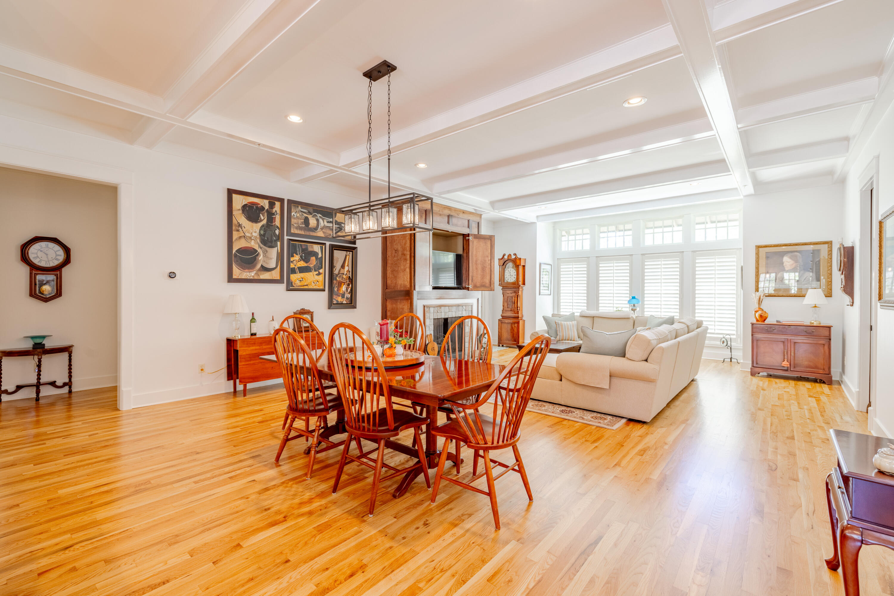 1508 Match Point Lane, Unit 302 Panama City Beach, FL 32413 - Photo 21 of 76 a view of a dining room and livingroom with furniture wooden floor a chandelier