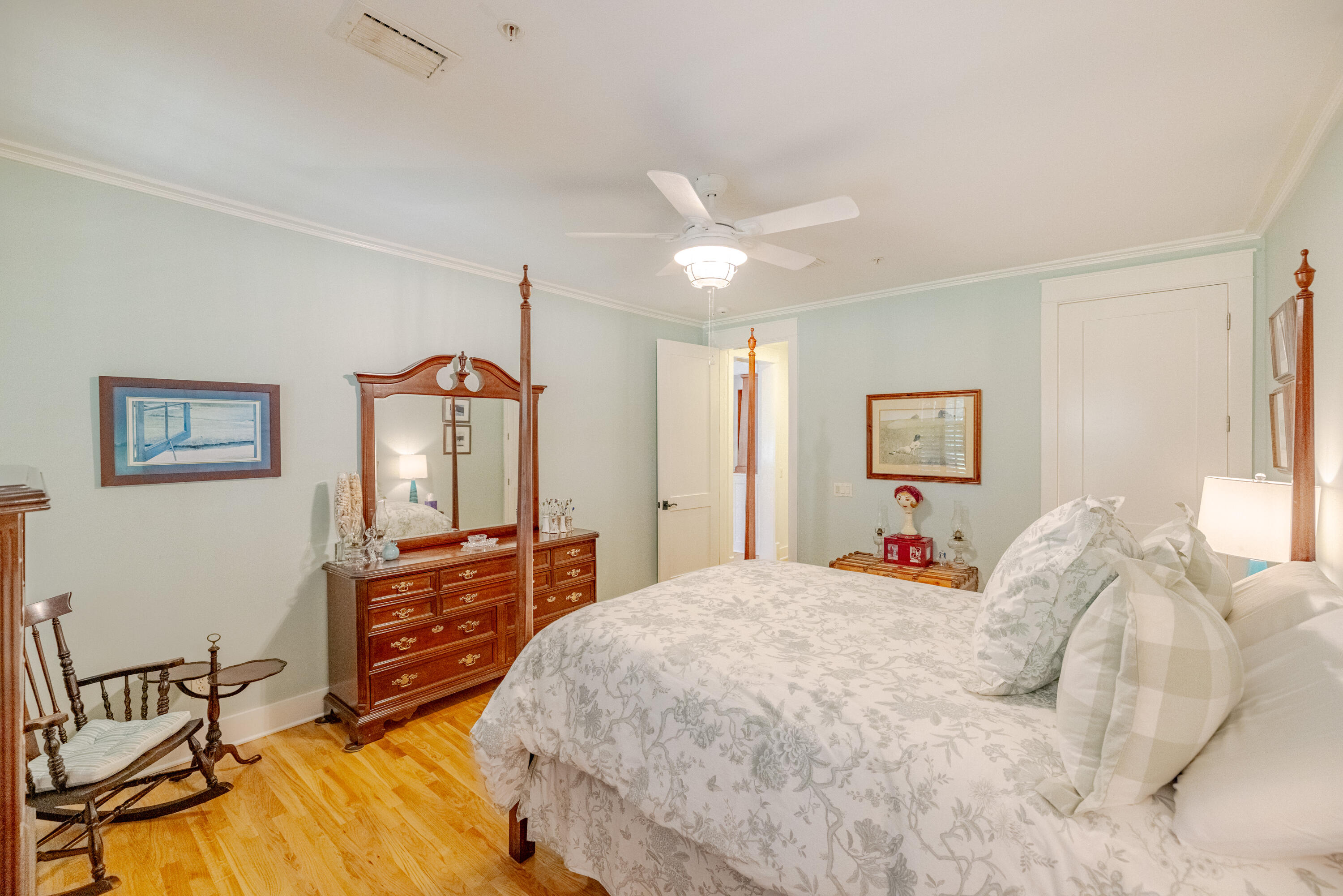 1508 Match Point Lane, Unit 302 Panama City Beach, FL 32413 - Photo 23 of 76 a bedroom with a bed and a chandelier