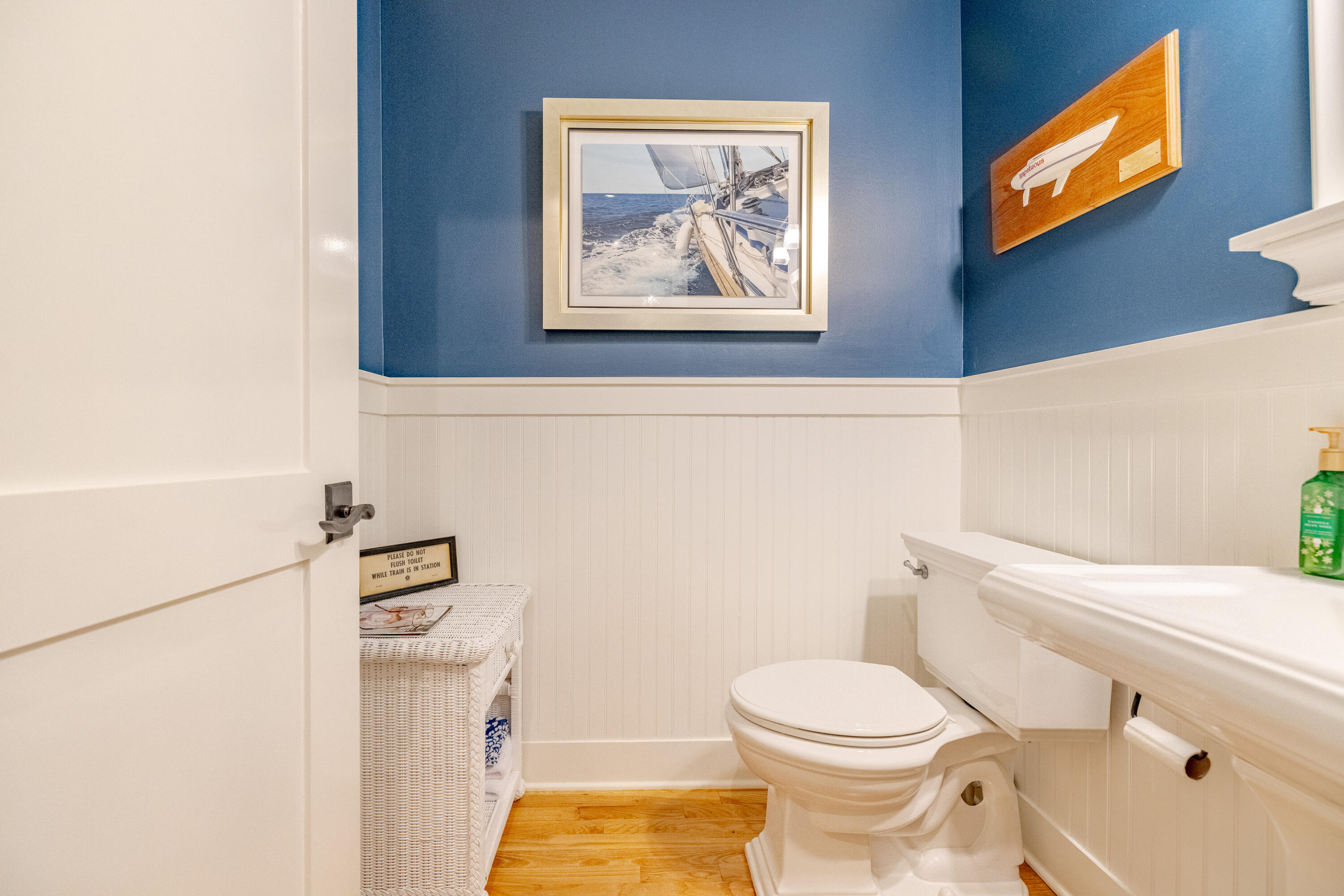 1508 Match Point Lane, Unit 302 Panama City Beach, FL 32413 - Photo 29 of 76 a white toilet sitting next to a bathroom sink