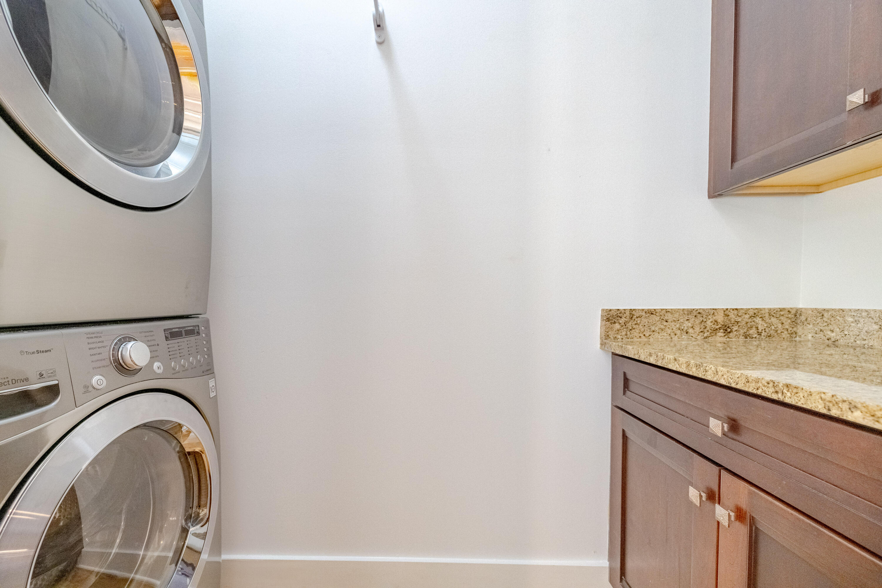 1508 Match Point Lane, Unit 302 Panama City Beach, FL 32413 - Photo 32 of 76 a utility room with dryer and washer