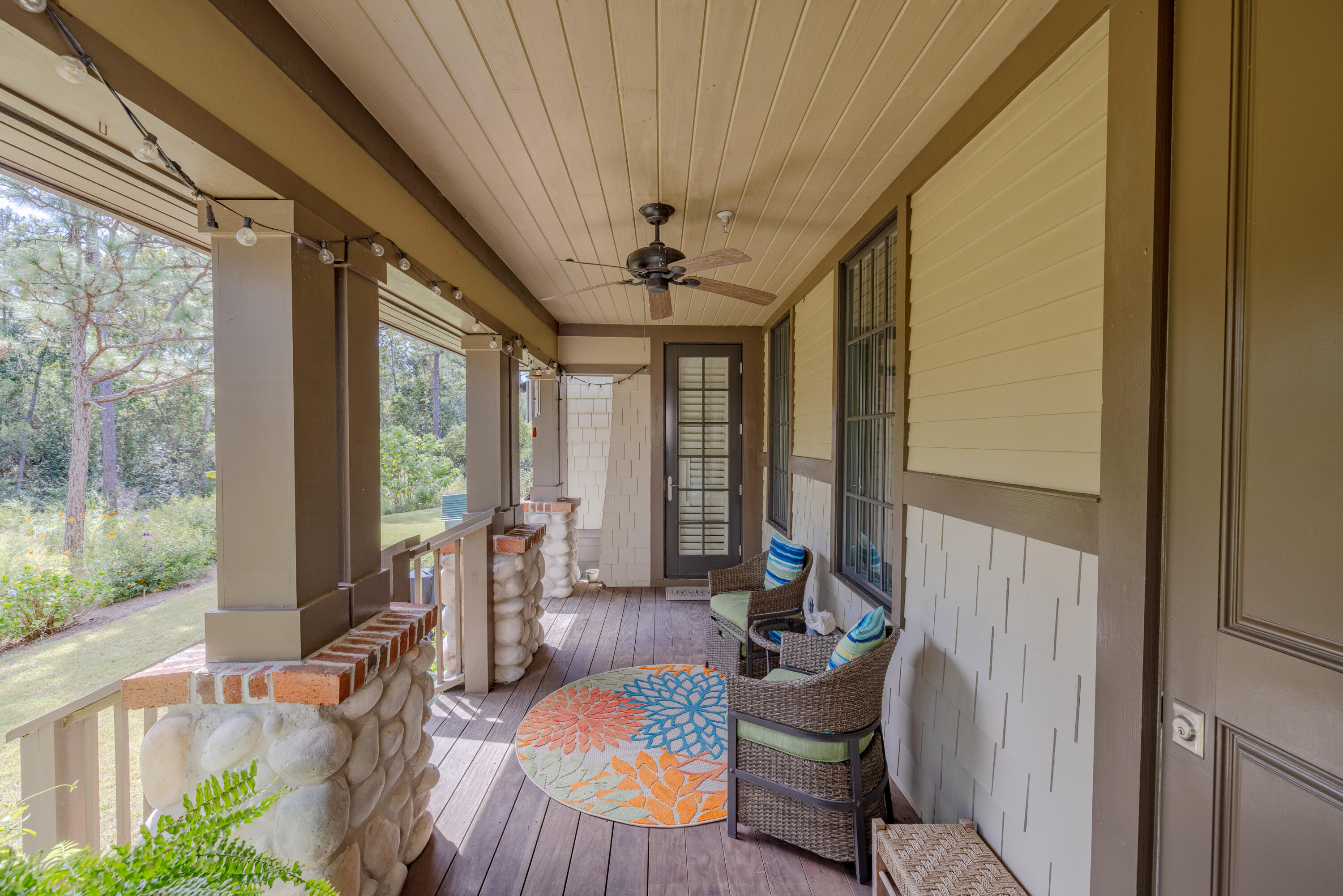 1508 Match Point Lane, Unit 302 Panama City Beach, FL 32413 - Photo 48 of 76 a living room with furniture and a large window