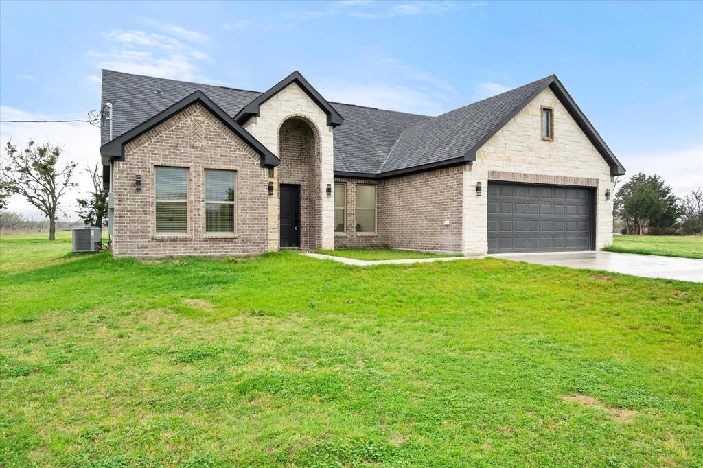 6771 Northwest County Road 1146 Barry, TX 75102 - Photo 24 of 34 a front view of house with yard and green space