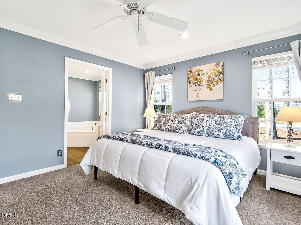 422 Intern Way Durham, NC 27713 - Photo 20 of 33 a bedroom with a bed and a chandelier