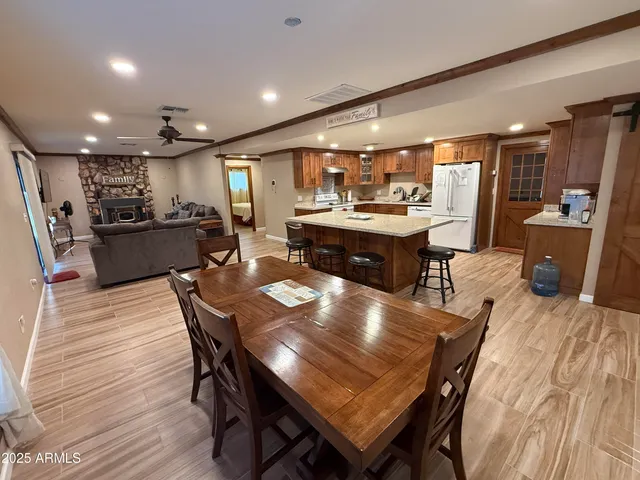 a large kitchen with a table and chairs
