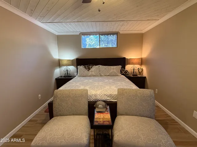 a bed room with a bed and a lamp