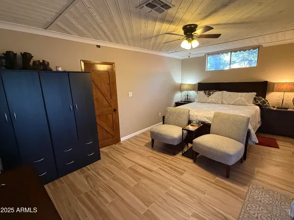 a bedroom with bed and window