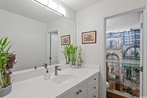 a bathroom with a sink a vanity and a mirror