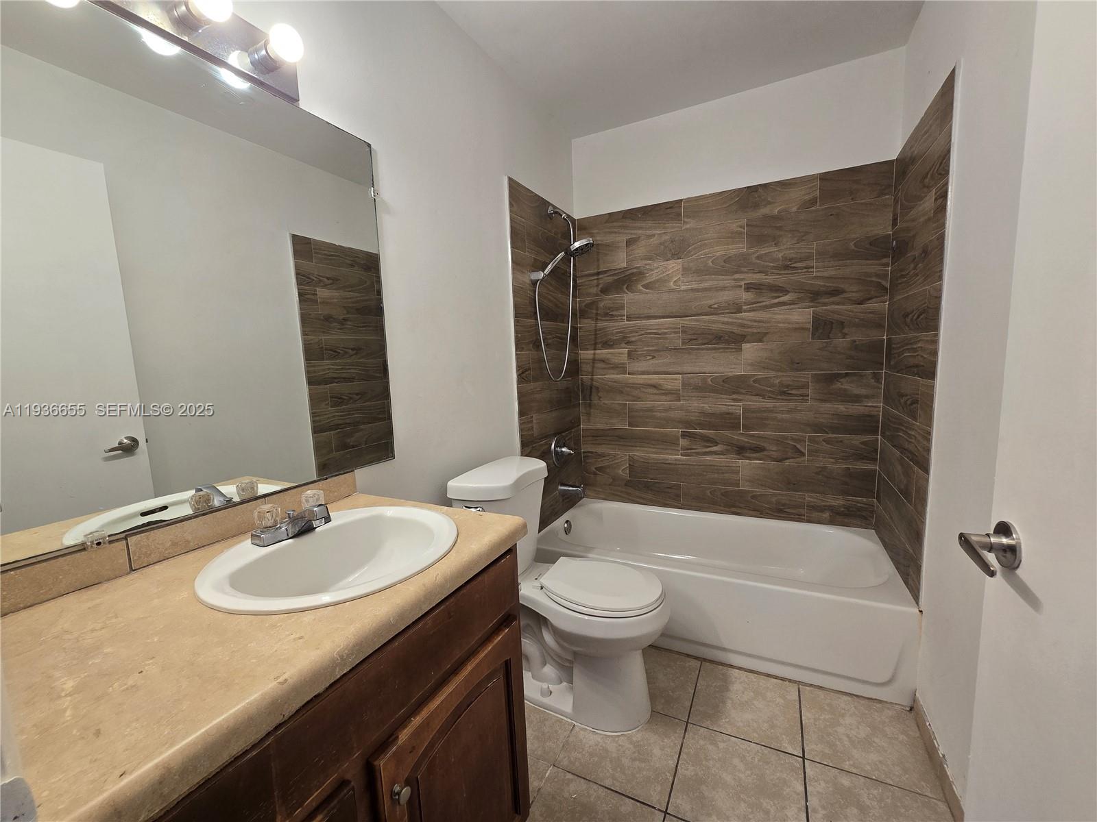 2153 Southwest 80th Terrace, Unit 2153 Miramar, FL 33025 - Photo 12 of 15 a bathroom with a sink a toilet and shower