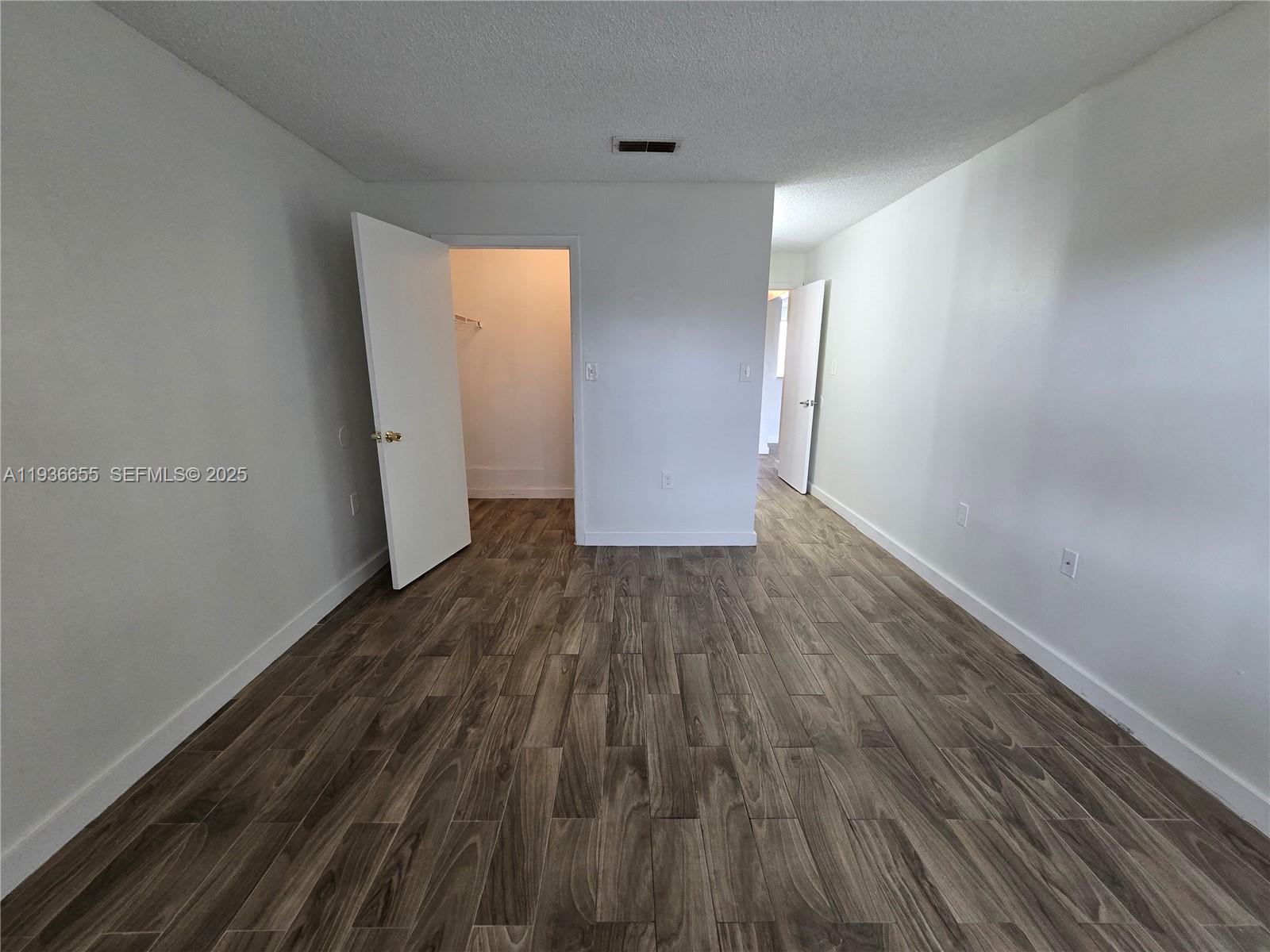 2153 Southwest 80th Terrace, Unit 2153 Miramar, FL 33025 - Photo 7 of 15 a view of a room with wooden floor
