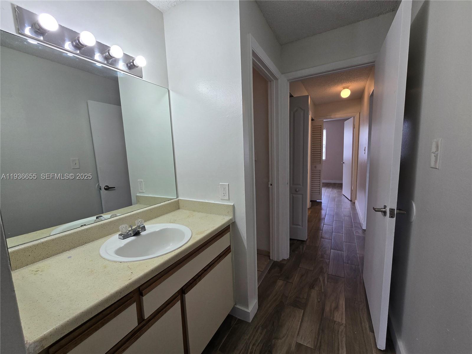 2153 Southwest 80th Terrace, Unit 2153 Miramar, FL 33025 - Photo 8 of 15 a bathroom with a sink double vanity and a mirror