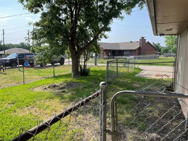 a view of a garden with a bench