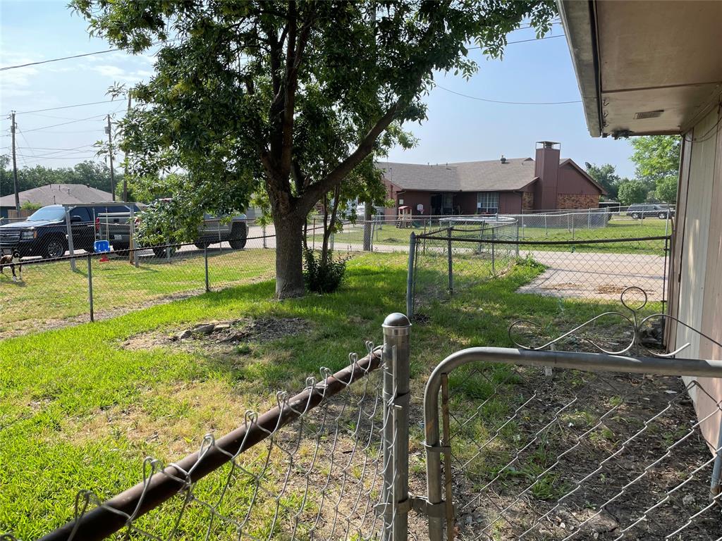 3522 Jewel Street Sachse, TX 75048 - Photo 18 of 18 a view of a garden with a bench