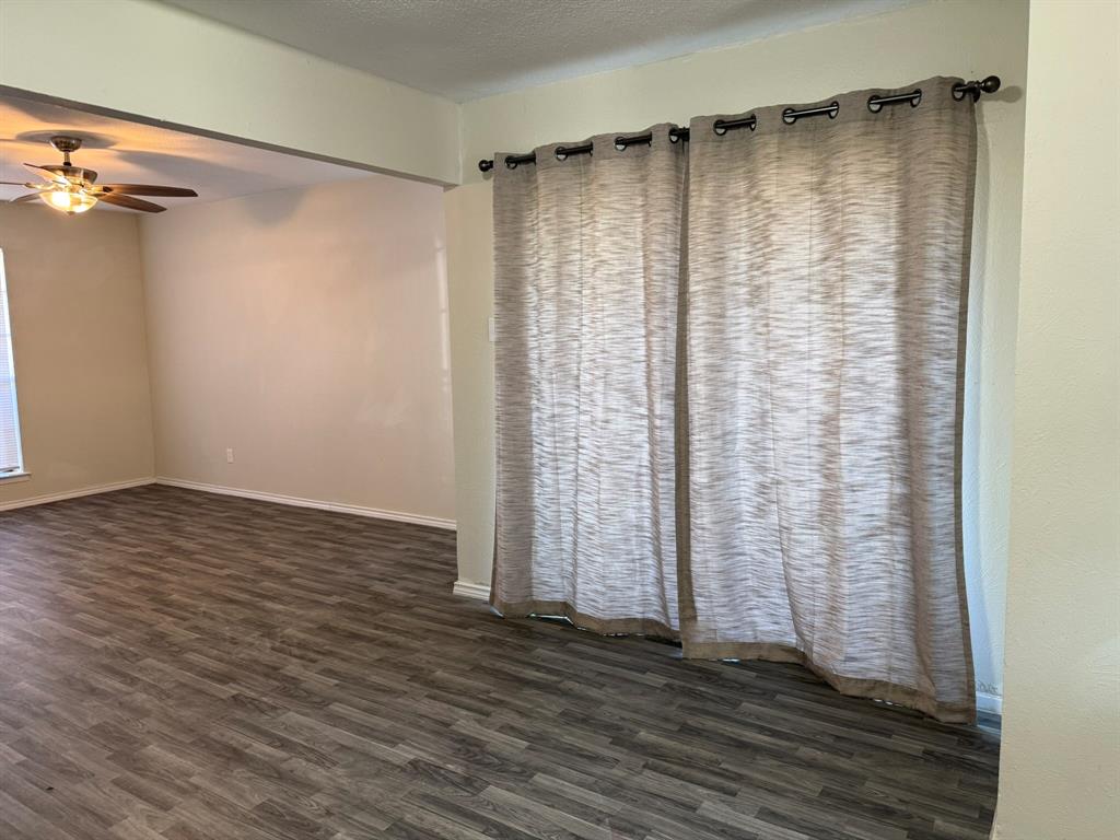 3522 Jewel Street Sachse, TX 75048 - Photo 6 of 18 a view of a room with wooden floor and bench
