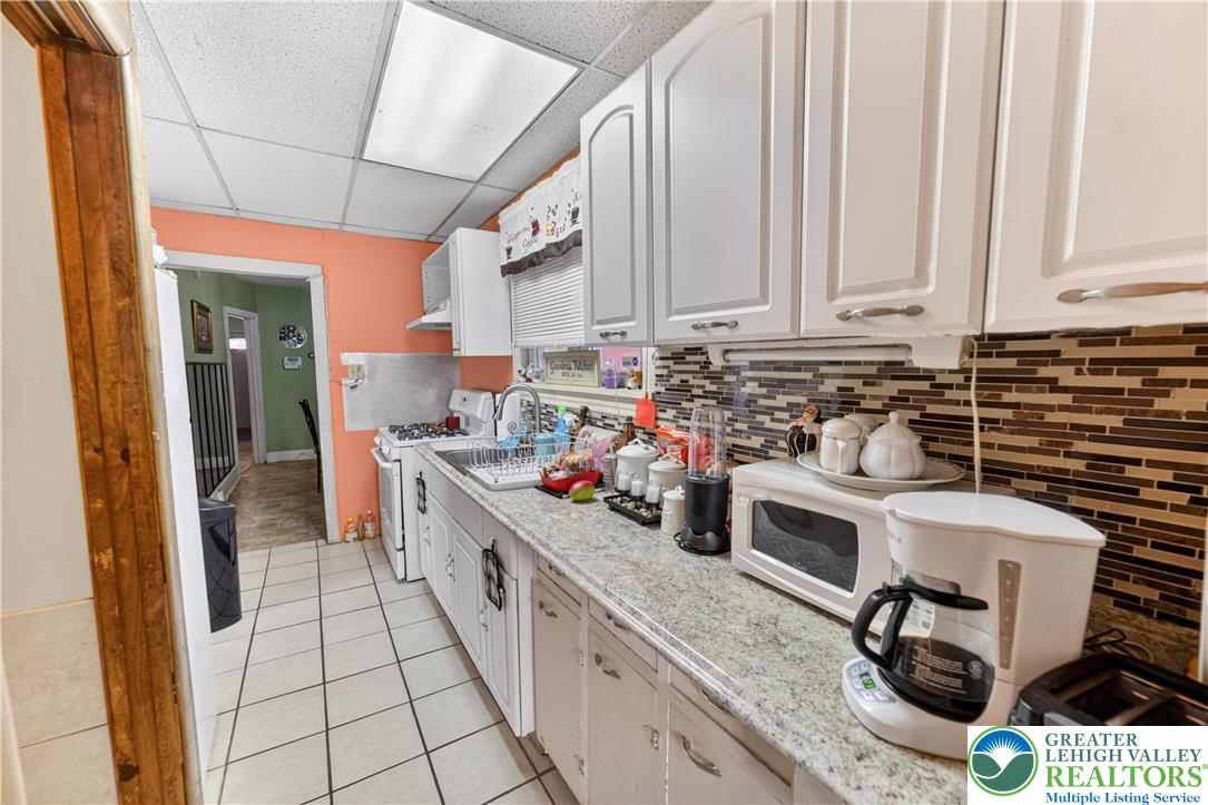 308 State Street Bethlehem, PA 18015 - Photo 12 of 30 a kitchen with stainless steel appliances a sink a stove and a refrigerator