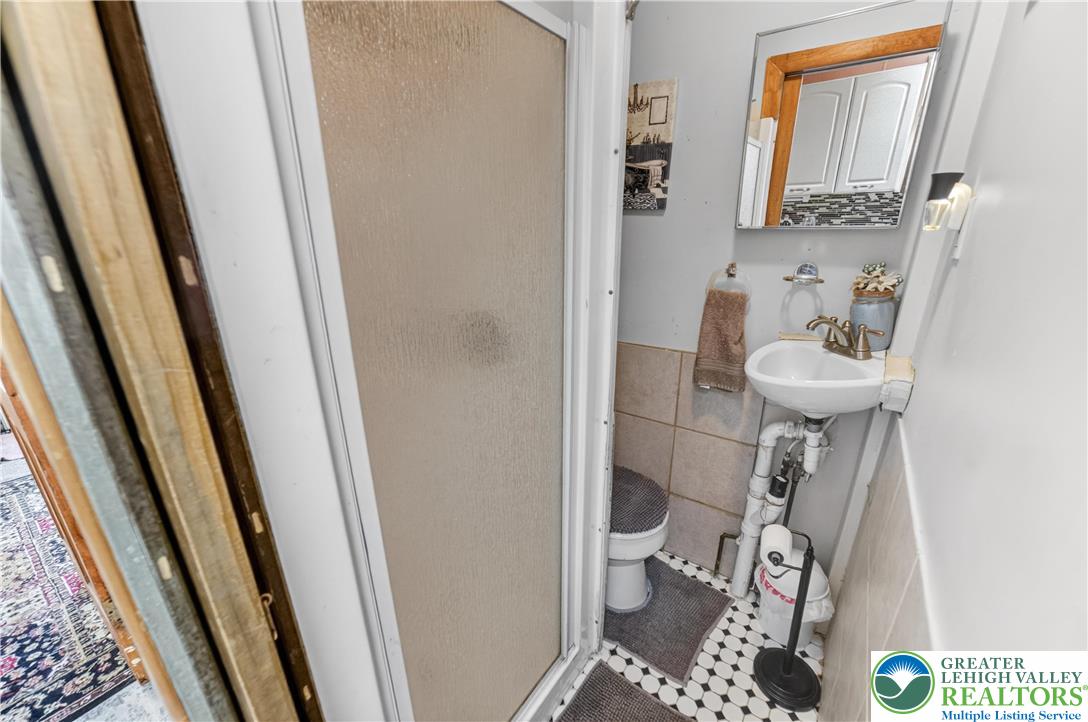 308 State Street Bethlehem, PA 18015 - Photo 13 of 30 a bathroom with a sink and a mirror