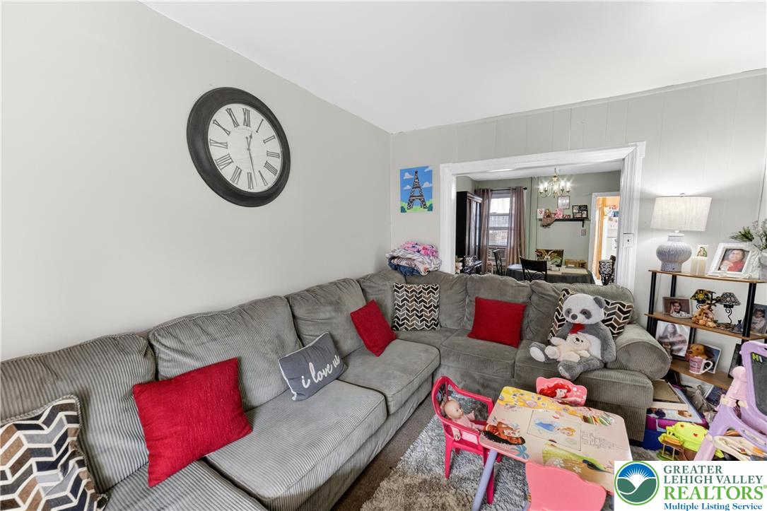308 State Street Bethlehem, PA 18015 - Photo 9 of 30 a living room with lots of furniture and a clock