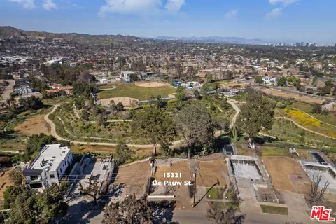 an aerial view of residential building and parking space