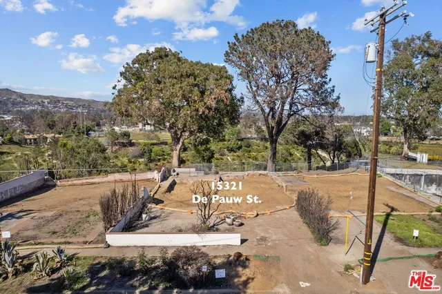 a view of a park with large trees