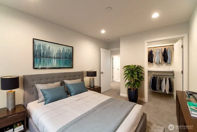 a bathroom with a double vanity sink a toilet and a bathtub