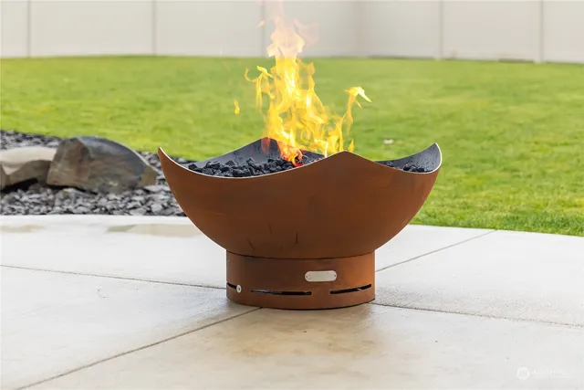 a view of a house with a yard and table