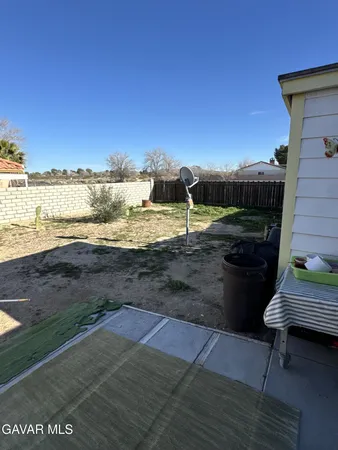 a view of a terrace with a yard