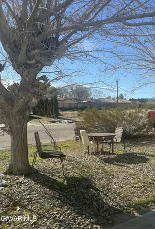 a view of a lake with outdoor seating
