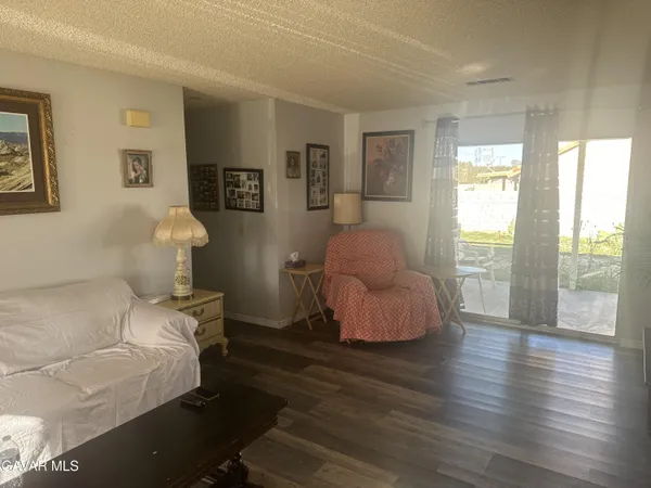 a bedroom with furniture and a window