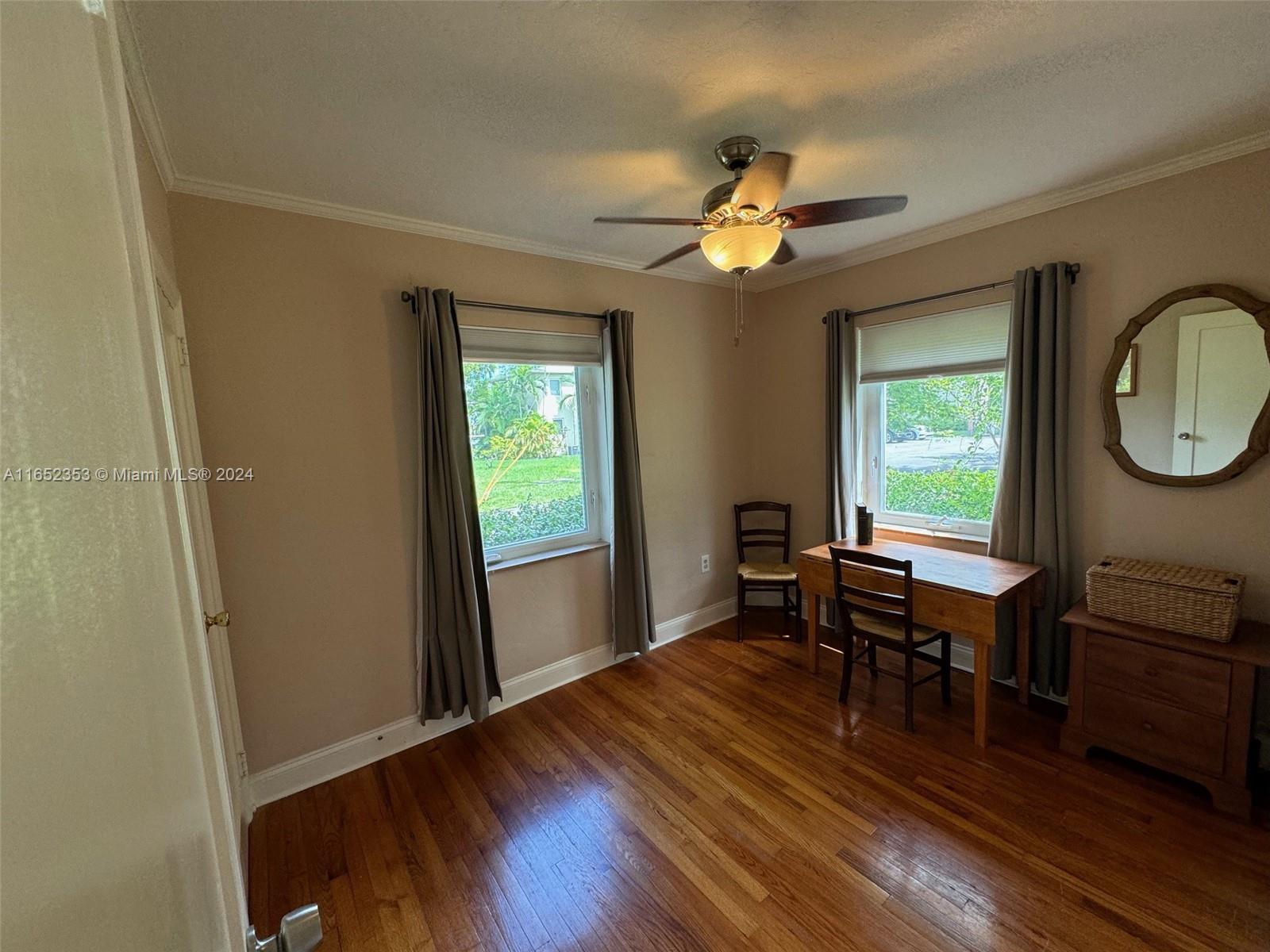 5530 Southwest 76th Street, Unit A Miami, FL 33143 - Photo 6 of 10 a view of a dining room with furniture window and wooden floor