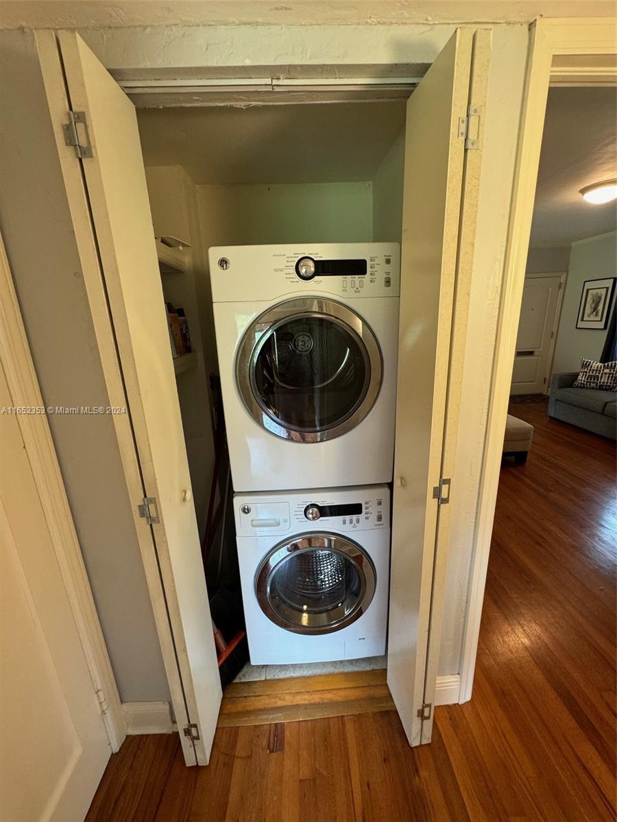 5530 Southwest 76th Street, Unit A Miami, FL 33143 - Photo 7 of 10 a utility room with wooden floor and washing machine