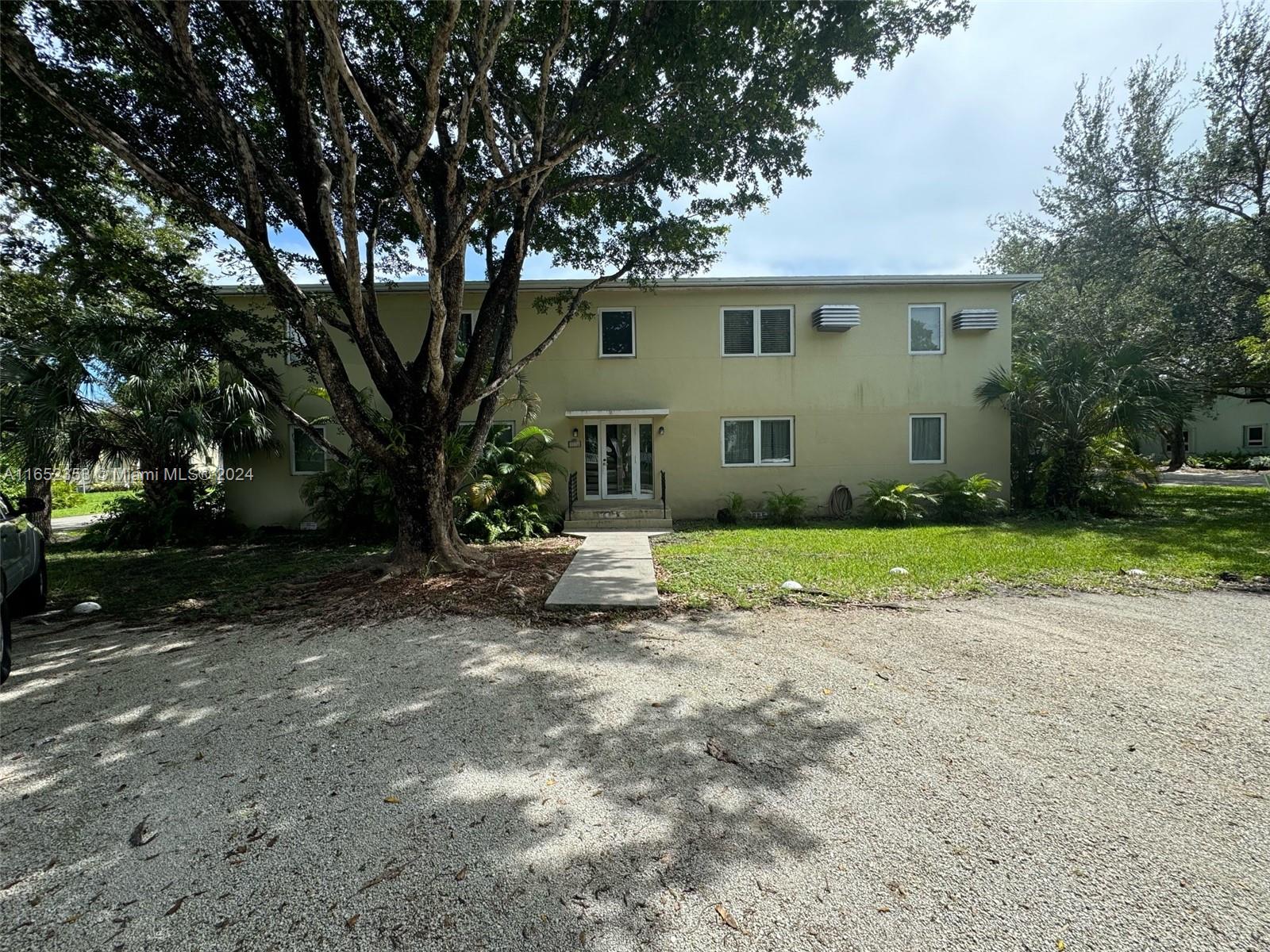 5530 Southwest 76th Street, Unit A Miami, FL 33143 - Photo 9 of 10 a view of a house with a yard