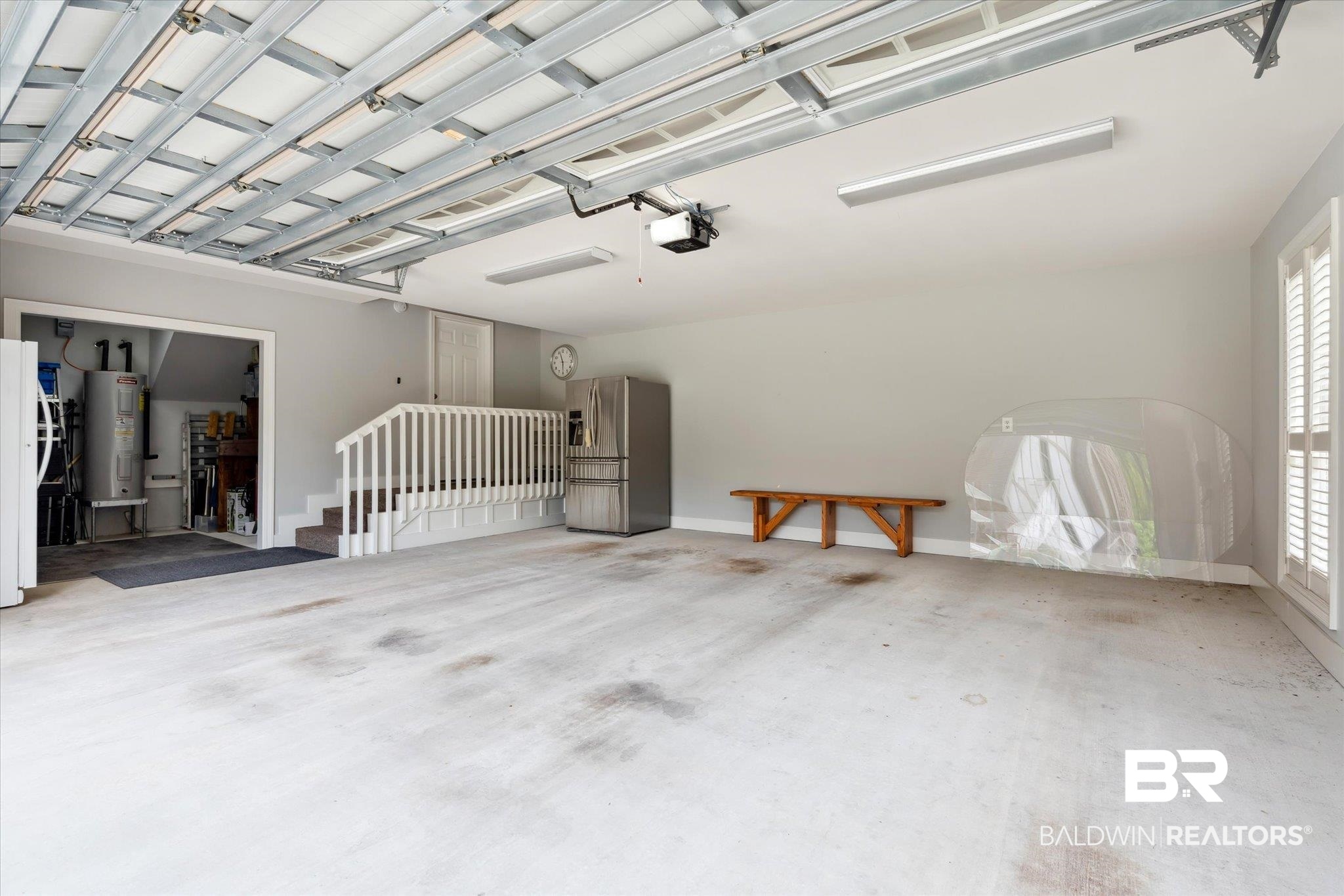 804 Country Club Road Mobile, AL 36609 - Photo 34 of 63 Garage with water heater and a garage door opener