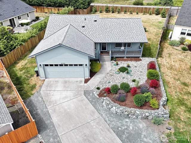 an aerial view of a house with outdoor space