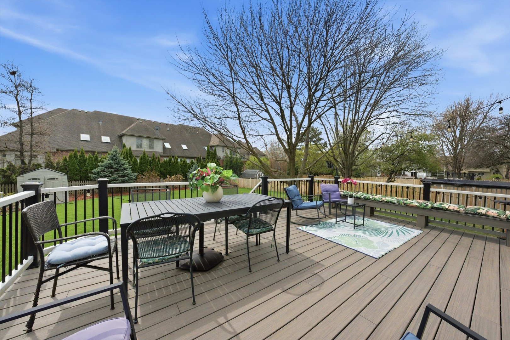18 Newgate Avenue Naperville, IL 60565 - Photo 27 of 29 a view of a deck with furniture and trees around