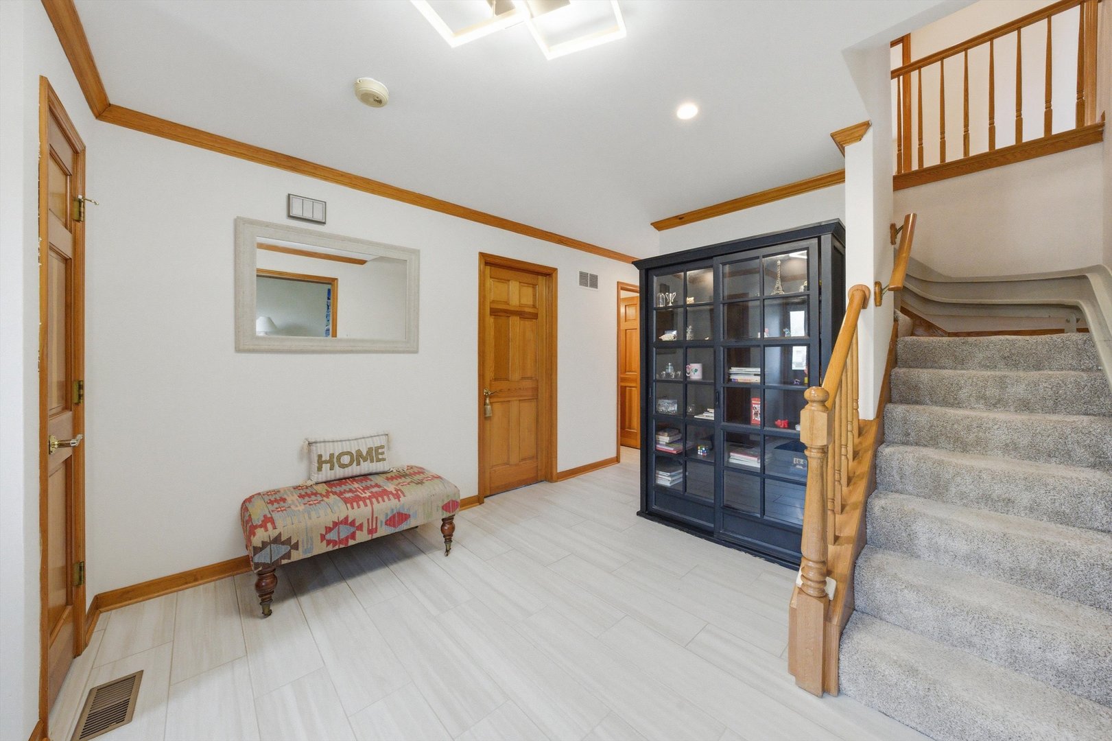 18 Newgate Avenue Naperville, IL 60565 - Photo 3 of 29 a living room with furniture and stairs