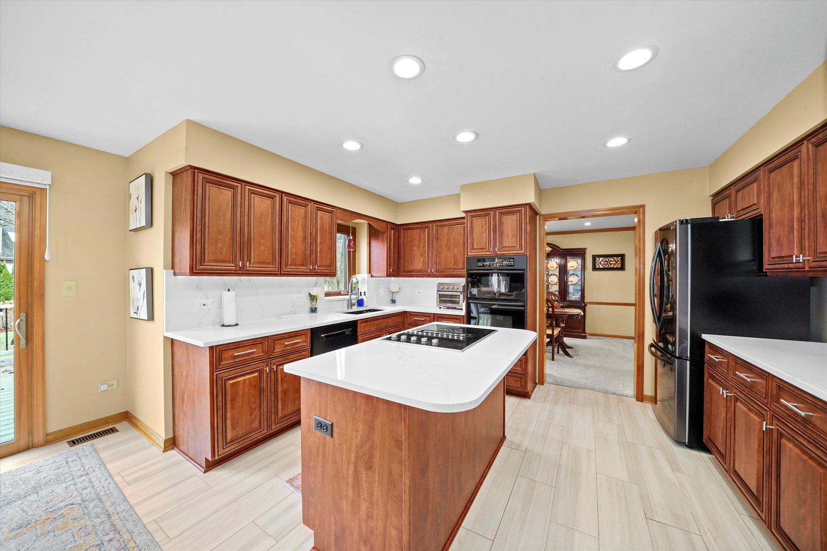 18 Newgate Avenue Naperville, IL 60565 - Photo 7 of 29 a kitchen with stainless steel appliances granite countertop a stove oven and a refrigerator