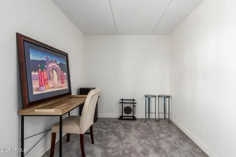 a view of a room with furniture and screen