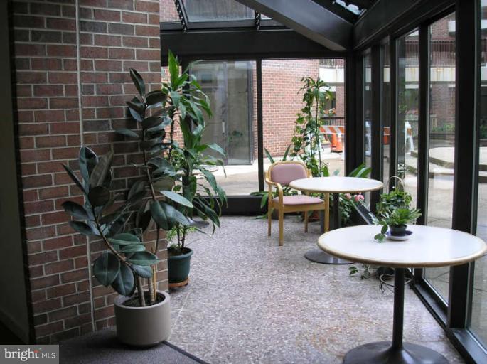 1951 Sagewood Lane, Unit 421 Reston, VA 20191 - Photo 15 of 22 Sun-filled glass enclosed atrium on the 1st floor