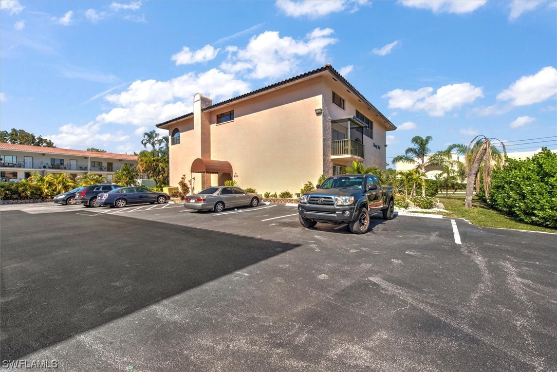828 Wiggins Pass Road, Unit 10 Naples, FL 34110 - Photo 16 of 17 a view of a street in front of house