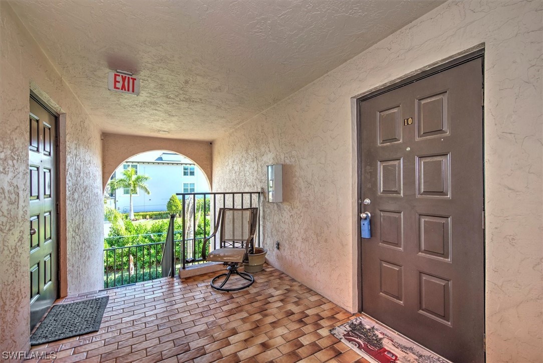 828 Wiggins Pass Road, Unit 10 Naples, FL 34110 - Photo 2 of 17 a view of entryway with a front door
