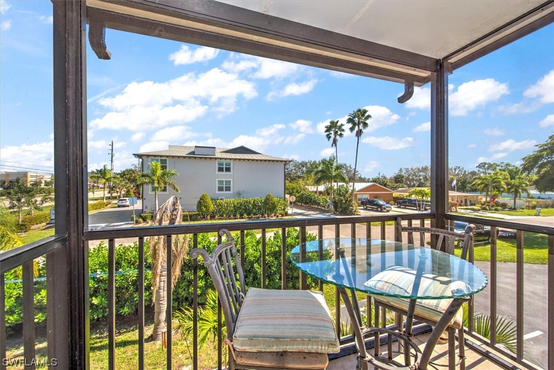 828 Wiggins Pass Road, Unit 10 Naples, FL 34110 - Photo 6 of 17 a view of a city from a balcony