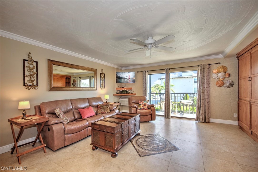 828 Wiggins Pass Road, Unit 10 Naples, FL 34110 - Photo 9 of 17 a living room with furniture and a window