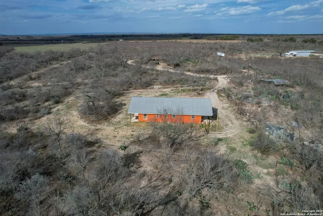 a aerial view of house with a yard