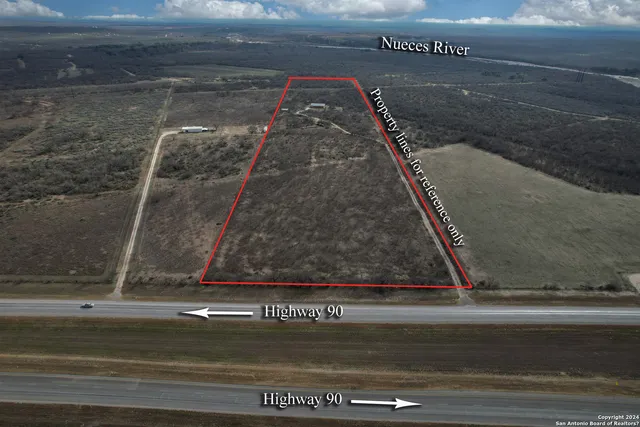 a swimming pool with outdoor seating and yard