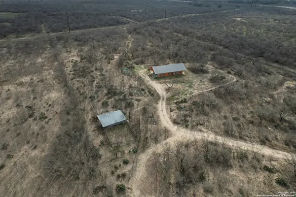 a aerial view of a house with a yard